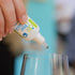 Image of UB free White Wine Drops being dropped into glass
